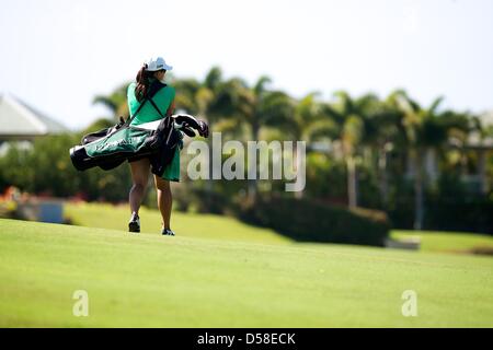 Kapalua, Hawaii, USA. 25th March 2013. Charlee Kapioho of the University of Hawaii walks the course during the 2013 Anuenue Spring Break Classic hosted by University of Hawaii at the Kapalua Bay Course on the island of Maui. Credit: Cal Sport Media / Alamy Live News Stock Photo