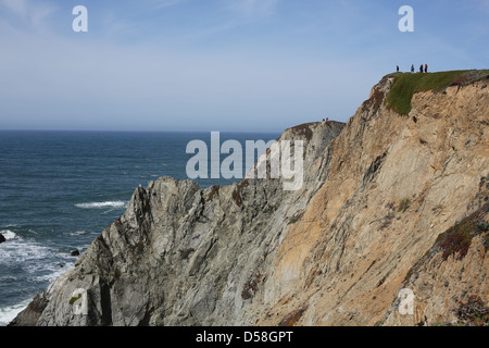 People standing on a trail at the top of a cliff at Bodega Head in Bodega Bay, California. Stock Photo