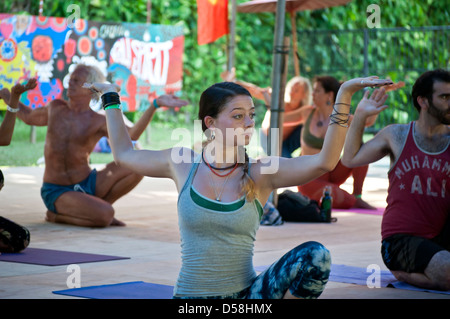 Bali, Indonesia-march 20, 2013: Rows of male and female adults, lying on colourful mats in a yoga class at Bali Spirit Festival. Stock Photo