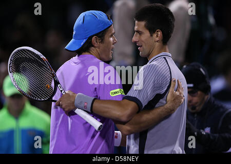 Miami, Florida, USA. 26th March 2013. Tommy Haas of Germany and Novak Djokovic of Serbia meet at the net after the match during day 9 of the Sony Open 2013. Credit: Mauricio Paiz / Alamy Live News Stock Photo