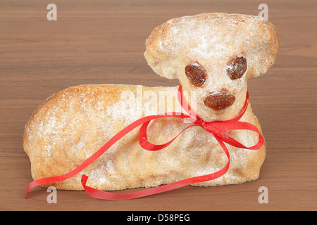 Easter lamb with powdered sugar isolated on wooden background Stock Photo