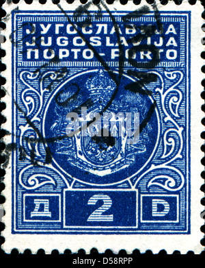 YUGOSLAVIA - CIRCA 1931: A stamp printed in Yugoslavia shows coat of arms of Kingdom Yugoslavia, circa 1931  Stock Photo