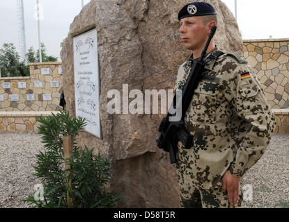 A Bundeswehr soldier stands guard at the 'Grove of Honour' for German soldiers killed in action at the Bundeswehr 'Camp Marmal' in Masar-i-Scharif in northern Afghanistan, Germany, 21 May 2010. Seven Bundeswehr soldiers were killed and thirteen injured in Afghanistan this April. Photo: MAURIZIO GAMBARINI Stock Photo