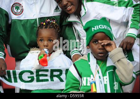 A young Nigeria fan blows a mini vuvuzela during the 2010 FIFA World Cup group B match between Argentina and Nigeria at Ellis Park stadium in Johannesburg, South Africa 12 June 2010. Photo: Achim Scheidemann - Please refer to http://dpaq.de/FIFA-WM2010-TC Stock Photo