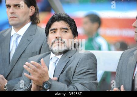 Argentinian coach Diego Armando Maradona (C) at the bench prior to the 2010 FIFA World Cup group B match between Argentina and Nigeria at Ellis Park stadium in Johannesburg, South Africa 12 June 2010. Photo: Achim Scheidemann - Please refer to http://dpaq.de/FIFA-WM2010-TC Stock Photo