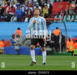 Argentina's Gabriel Heinze celebrates scoring the 1-0 during the 2010 FIFA World Cup group B match between Argentina and Nigeria at Ellis Park stadium in Johannesburg, South Africa 12 June 2010. At right Argentina's Lionel Messi. Photo: Achim Scheidemann - Please refer to http://dpaq.de/FIFA-WM2010-TC Stock Photo