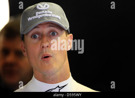 Record-World Champion Michael Schumacher of Mercedes GP stands in his pit and watches the times of the other drivers during the third training on race track ''Gille Villeneuve'' in Montreal, Canada, 12 June 2010. After a one year break on the race track, the Formula One Grand Prix of Canada will be held in Montreal on 13 June 2010. Photo: Jens Buettner Stock Photo