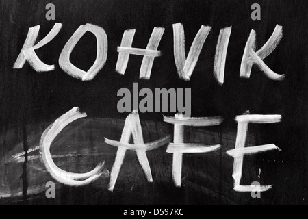 Advertising chalkboard of street cafe with text label on English and Estonian Stock Photo