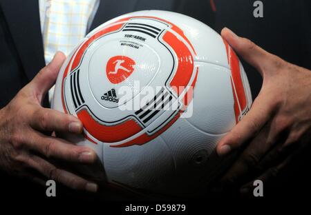 The new ball of the German Bundesliga is shown during a press conference of the German team in Velmore Grand Hotel in Erasmia near Pretoria, 15 June 2010. The ball is named 'Torfabrik'. Photo: Marcus Brandt dpa Stock Photo