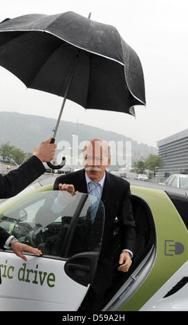 Dieter Zetsche, CEO of Daimler AG, gets out of a 'smart electric drive' in Stuttgart, Germany, 18 June 2010. Car manufacturer Daimler, power supplier EnBW and Baden-Wuerttemberg want to build about 700 loading stations until the end of 2011 and test 200 vehicles with electric and fuel cell-powered engines in the model project 'e-mobility Baden Wuerttemberg'. Photo: Marijan Murat Stock Photo