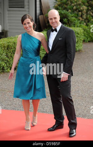 Swedish Prime Minister Fredrik Reinfeldt and his wife Filippa arrive at the goverment dinner held at the Eric Ericson Hall on Skeppsholmen, one of the islands of Stockholm, on the occasion of the wedding of Crown Princess Victoria of Sweden and Daniel Westling in Stockholm, Sweden, 18 June 2010. The royal wedding ceremony of Crown Princess Victoria of Sweden and Daniel Westling wil Stock Photo
