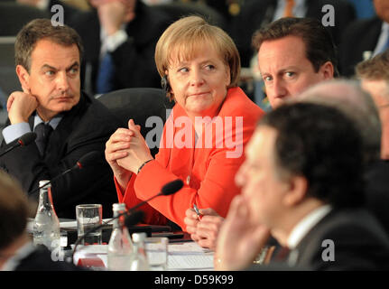 The Spanish Prime Minister Jose Luis Rodriguez (L-R), the Chancellor of Germany Angela Merkel and the British Prime Minister David Cameron follow the beginning of the G-20 session in Toronto, Canada on 27 June 2010. The G-20 have assembled for debates in the Canadian metropolis. PHOTO: PETER GRIMM Stock Photo