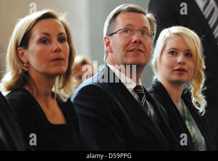 Presidential candidate Christian Wulff (C), his wife Bettina Wulff (L), and his daughter from first marriage Annalena (R) arrive for an ecumenical church service at St Hedwig cathedral in Berlin, Germany, 30 June 2010. The Federal Convention will elect the next German President later the day. Photo: HANNIBAL Stock Photo