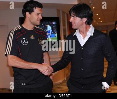 World Cup 2010 - The injured captain of the German national soccer team Michael Ballack (L) meets the German federal trainer Joachim Loew (R) in the hotel Southern Sun in Cape Town, South Africa, 01 July 2010. Photo: Press Photo: ULMER/ Michael Kienzler dpa Stock Photo