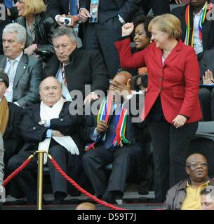 German Chancellor Angela Merkel (CDU, R), South African President Jacob Zuma (C) and FIFA President Joseph Sepp Blatter on the stand during the 2010 FIFA World Cup quarterfinal match between Argentina and Germany at the Green Point Stadium in Cape Town, South Africa 03 July 2010. Photo: Marcus Brandt dpa - Please refer to http://dpaq.de/FIFA-WM2010-TC Stock Photo