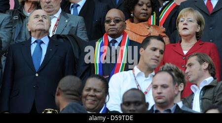 German Chancellor Angela Merkel (CDU, R) stands next to South African President Jacob Zuma (C) and FIFA President Joseph Sepp Blatter during the 2010 FIFA World Cup quarterfinal match between Argentina and Germany at the Green Point Stadium in Cape Town, South Africa 03 July 2010. Photo: Marcus Brandt dpa - Please refer to http://dpaq.de/FIFA-WM2010-TC  +++(c) dpa - Bildfunk+++ Stock Photo