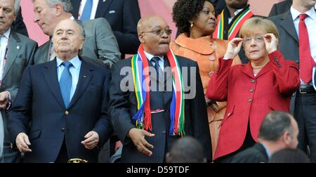 German Chancellor Angela Merkel (CDU, R) stands next to South African President Jacob Zuma (C) and FIFA President Joseph Sepp Blatter during the 2010 FIFA World Cup quarterfinal match between Argentina and Germany at the Green Point Stadium in Cape Town, South Africa 03 July 2010. Photo: Marcus Brandt dpa - Please refer to http://dpaq.de/FIFA-WM2010-TC  +++(c) dpa - Bildfunk+++ Stock Photo