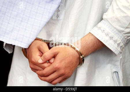 Defendant Rilwan C. is in the dock during his trial in Hamburg, Germany, 06 July 2010. Rilwan C. is charged with murder, allegedly he had gunned down a taxi driver on 14 January 2010 with three shots into the back of the head. Photo: PHILIPP GUELLAND Stock Photo