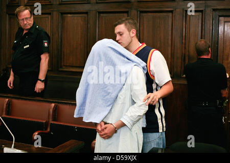 Defendant Rilwan C. is in the dock during his trial in Hamburg, Germany, 06 July 2010. Rilwan C. is charged with murder, allegedly he had gunned down a taxi driver on 14 January 2010 with three shots into the back of the head. Photo: PHILIPP GUELLAND Stock Photo