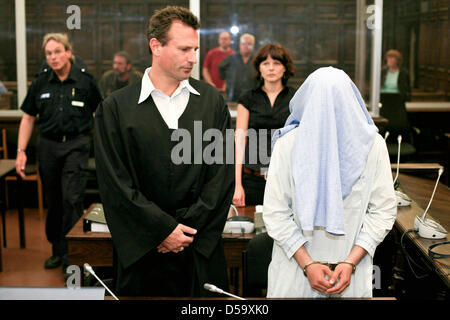 Defendant Rilwan C. is in the dock during his trial in Hamburg, Germany, 06 July 2010. Rilwan C. is charged with murder, allegedly he had gunned down a taxi driver on 14 January 2010 with three shots into the back of the head. Photo: PHILIPP GUELLAND Stock Photo