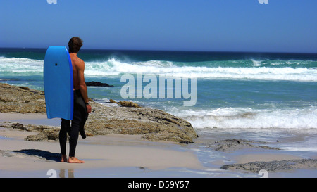 surfer at beach, witsand bay, near cape town, south africa Stock Photo
