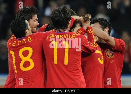 Spanish players celebrate Carles Puyol (5) after he scored the 1-0 during the 2010 FIFA World Cup semi-final match between Germany and Spain at the Durban Stadium in Durban, South Africa 07 July 2010. Photo: Marcus Brandt dpa - Please refer to http://dpaq.de/FIFA-WM2010-TC  +++(c) dpa - Bildfunk+++ Stock Photo