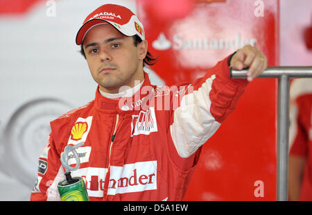 Brazilian Formula One race driver Felipe Massa from the team Ferrari stands in his paddock at the race track during the first training session in Silverstone, England, 9 July 2010. This weekend, the British grand prix starts with the tenth race of the Formula One season 2010. Photo: Carmen Jaspersen Stock Photo