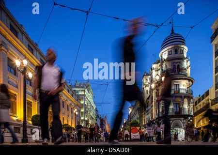 Seville, Spain, pedestrians on the Avenida de la Constitucion in the evening Stock Photo