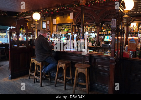 Man in Irish Pub in Dublin, Ireland Stock Photo