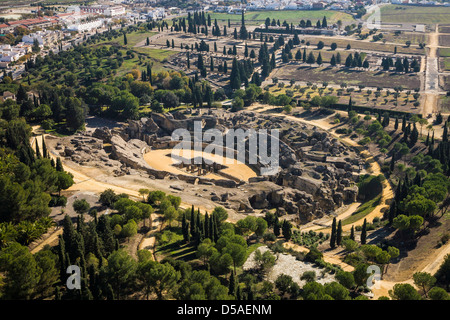 Ruins of amphitheatre in Roman city of Italica Santiponce, Seville, Spain. Aerial view Stock Photo