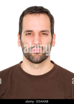 Portrait of a 3-day bearded young man squinting his eyes Stock Photo