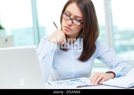 Image of a business lady being busy working Stock Photo