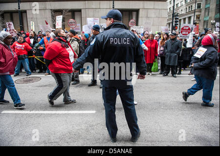Chicago, USA. 27th March, 2013. Students, parents, and teachers march in downtown Chicago in opposition of the closing of 53 Chicago public schools. Credit: Max Herman / Alamy Live News Stock Photo
