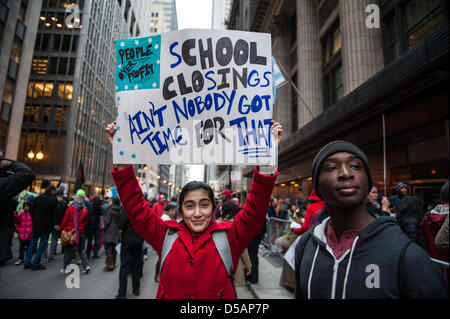 Chicago, USA. 27th March, 2013. Students, parents, and teachers rally in downtown Chicago in opposition of the closing of 53 Chicago public schools. Credit: Max Herman / Alamy Live News Stock Photo