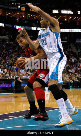 New Orleans, Louisiana, USA. 27th March 2013. Los Angeles Clippers power forward Blake Griffin (32) drives against New Orleans Hornets power forward Anthony Davis (23) during the NBA basketball game between the New Orleans Hornets and the Los Angeles Clippers at the New Orleans Arena in New Orleans, LA. Cal Sport Media / Alamy Live News Stock Photo