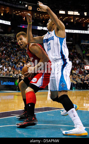 New Orleans, Louisiana, USA. 27th March 2013. Los Angeles Clippers power forward Blake Griffin (32) drives against New Orleans Hornets power forward Anthony Davis (23) during the NBA basketball game between the New Orleans Hornets and the Los Angeles Clippers at the New Orleans Arena in New Orleans, LA. Cal Sport Media / Alamy Live News Stock Photo