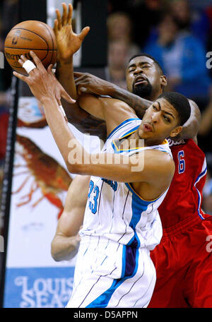 New Orleans, Louisiana, USA. 27th March 2013. Los Angeles Clippers center DeAndre Jordan (6) and New Orleans Hornets power forward Anthony Davis (23) compete for a rebound during the NBA basketball game between the New Orleans Hornets and the Los Angeles Clippers at the New Orleans Arena in New Orleans, LA. Cal Sport Media / Alamy Live News Stock Photo
