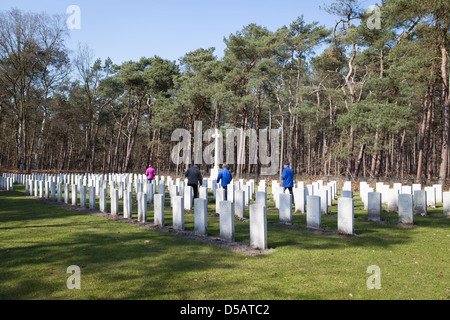 Overview of the British War Cemetery at Valkenswaard in the Netherlands with four visitors. Stock Photo
