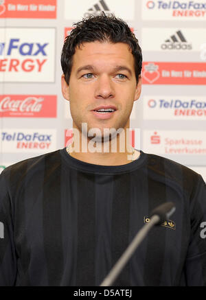 The former and new team player of Bayer Leverkusen, Michael Ballack sits at a press conference on the occasion of Ballack's return in Leverkusen, Germany on 14 July 2010. Ballack changes teams from the FC Chelsea back to Bayer Leverkusen. PHOTO: ACHIM SCHEIDEMANN Stock Photo