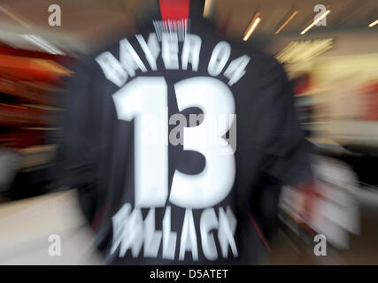 The jersey of the former and newly returned player of Bayer Leverkusen, Michael Ballack, hangs in a fan shop during the presentation of the national team player in Leverkusen, Germany, 14 July 2010. Ballack changes teams from the FC Chelsea back to Bayer Leverkusen. PHOTO: ACHIM SCHEIDEMANN Stock Photo