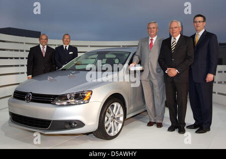 The handout picture dated 19 July 2010 by the Volkswagen Group shows (L-R) Christian Klingler, managing director, Walter de'Silva, chef designer of the Volkswagen Group, Martin Winterkorn, chairman of the Board of Management of Volkswagen Group, Ulrich Hackenberg, managing director of development and Mark Barnes, Volkswagen Group of America next to the new model of the VW Jetta, wh Stock Photo