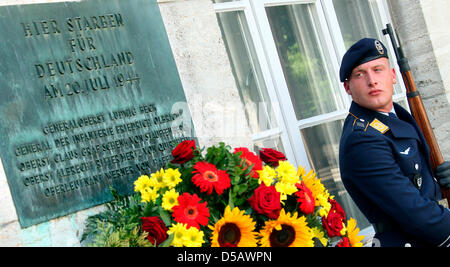 A soldier belonging to the guard of the German Federal Armed Forces stands besides a commemorative plaque for the executed officers of 20 July 1944 at the Bendlerblock in Berlin, Germany, 20 July 2010. On the occasion of the 66th centenary of 20 July 1944, the failed assassination attempt on Hitler, a ceremony in memory of the executed members of the resistance was held. Photo: Wol Stock Photo