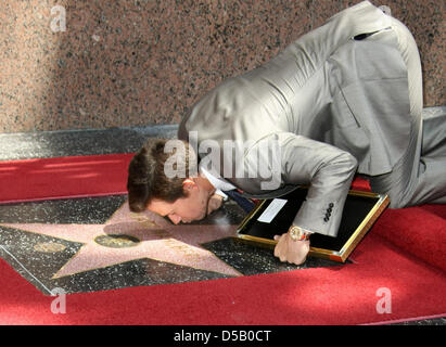 US actor Mark Wahlberg kisses his  new star on the Hollywood Walk of Fame in Los Angeles, USA, July 29, 2010. Photo: Hubert Boesl Stock Photo