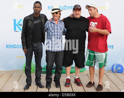 Cast members (L-R) US actors Chris Rock, DAvid Spade, Kevin James and Adam Sandler arrive for the premiere of his film 'Grown Ups' at the 'O2 World Arena' in Berlin, Germany, 30 July 2010. The film is in German cinemans from 05 August on. Photo: Jens Kalaene Stock Photo