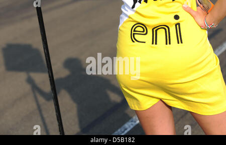 A grid girl stands at the starting line for the start of the GP 3 series on Hungaroring nearby Budapest, Hungary, 31 July 2010. The Hungarian Grand Prix will take place on 1 August as the twelfth race of the 2010 Formula One season. Photo: Peter Steffen Stock Photo