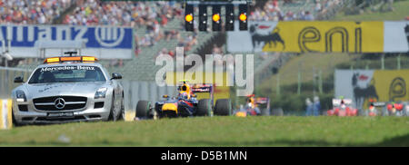 The safety car leads the race cars at the Hungarian Grand Prix in Budapest, Hungary, 01 August 2010. Webber won the race ahead of Alonso and Vettel. Photo: Peter Steffen Stock Photo