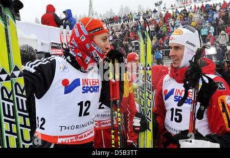 Austrian Felix Gottwald (R) talks to German Bjoern Kircheisen after the 10km cross country skiing competition of the nordic combined world cup event in Oberhof, Germany, 03 January 2010. Gottwald finished second ahead of Kircheisen. Photo: HENDRIK SCHMIDT Stock Photo