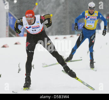 German Bjoern Kircheisen (front) and French Jason Lamy Chappuis shown in action during the 10km cross country skiing competition of the nordic combined world cup event in Oberhof, Germany, 03 January 2010. Kircheisen finished third. Photo: HENDRIK SCHMIDT Stock Photo