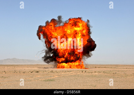 US Marines with 1st Explosive Ordnance Disposal Company conduct a controlled explosion to dispose of dangerous ammunition March 17, 2013 in Helmand province, Afghanistan. Stock Photo