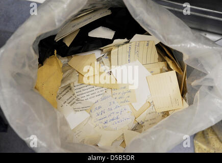 A bag filled with shredded files of former East German security police ('STASI') are stored at the so called 'Stasi-Unterlagenbehoerde', a Federal German Office, which preserves, reconstructs and makes former STASI files accessible to the public in Berlin, Germany, 11 January 2010. Almost 20 years ago, on 15 January 1990 thousands of demonstrators stormed the STASI headquarters on  Stock Photo